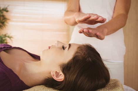 A reiki practitioner healing a client-Life massage and wellness(Chakra Balancing Massage)
